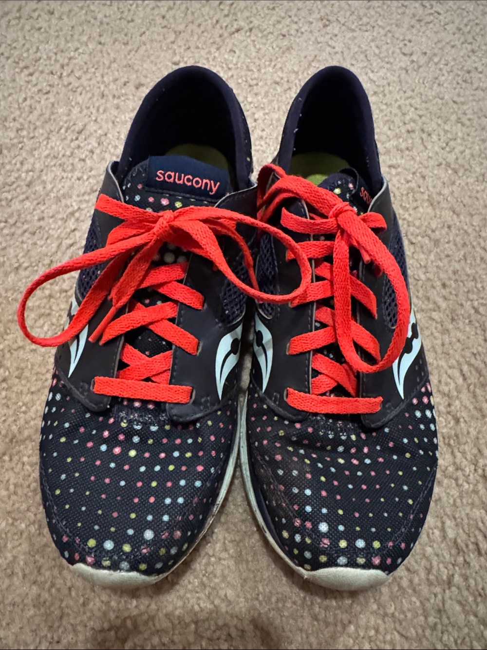 Saucony women’s Navy Polka Dot Pattern Sneakers with Orange Laces